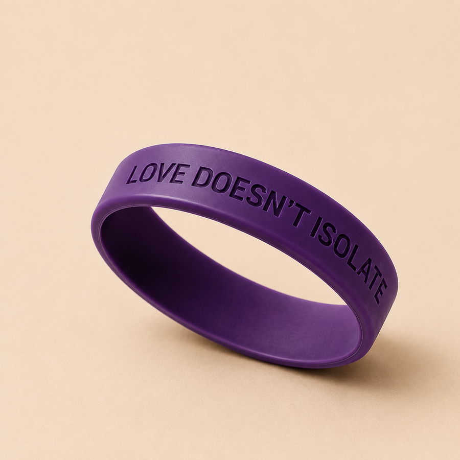 Purple silicone band showing the embossed Love Doesn't Isolate message
